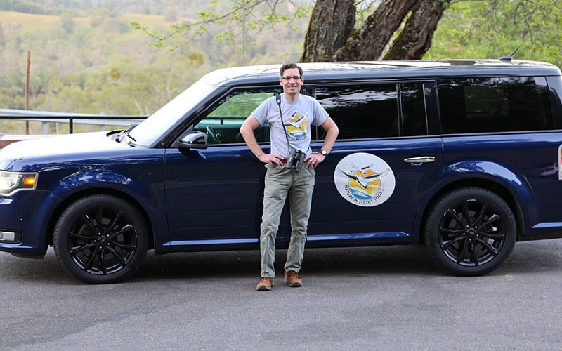 Spencer in front of his tour vehicle